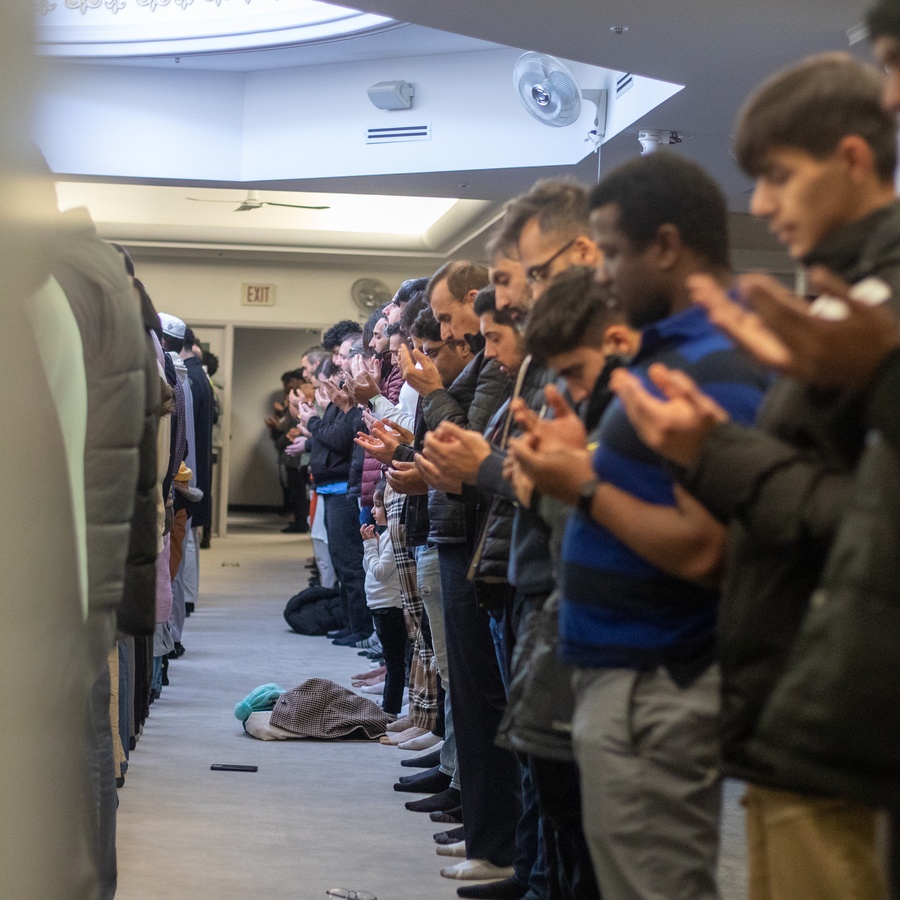 Group of Muslims praying at Islamic Centre of Canada