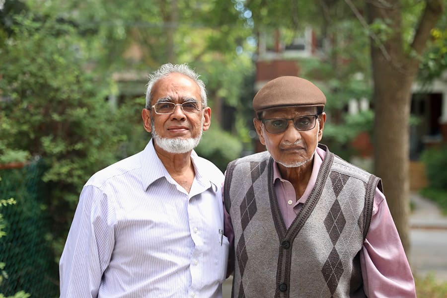 2 Senior men outside of Jami Masjid