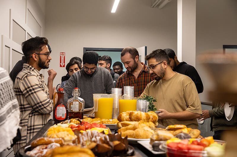 ISNA Canada volunteers serving food at an event