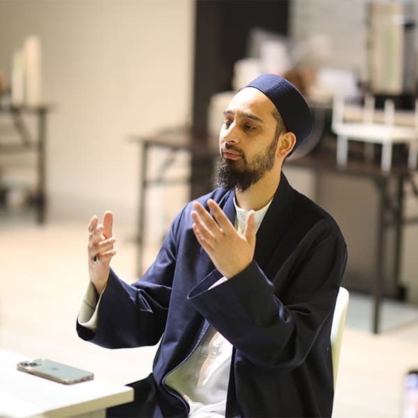 A Muslim man speaking to a group