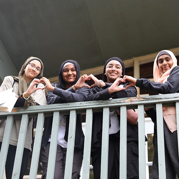 MYNA Girls making hearts with hands